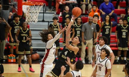 Lawrence High boys relinquish late lead, fall to Topeka High in 66-65 thriller